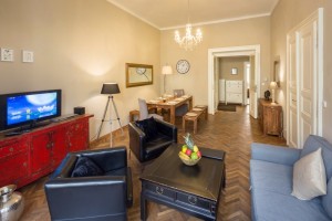 Living room with large sofa bed & dining table